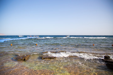 Coast of the Red Sea, Egypt. surf line. Wind and waves. A little storm. Background tourism and travel. Blue water and sky.