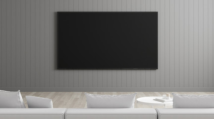 View of living room in minimal style with television on grey laminate wall. Mock-up idea of sitting and watching TV on white sofa, 3D rendering.	