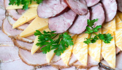 .slicing cheese and sausage and greens