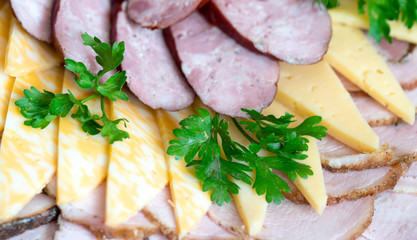 .slicing cheese and sausage and greens