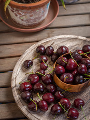 Cherries in rustic environment overhead plane