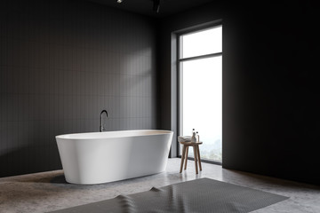 Fototapeta na wymiar Loft gray tile bathroom corner with tub