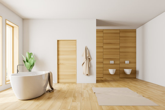 White and wooden bathroom with tub and toilets