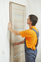 carpenter at door installation
