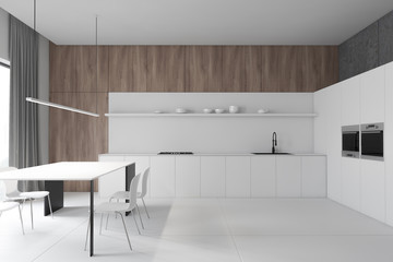 Wooden and white kitchen, counters and table