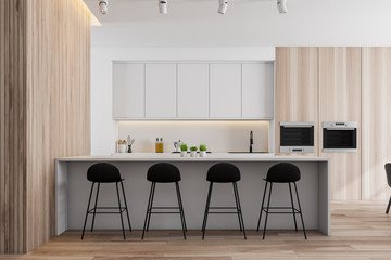 Wooden and white kitchen, counters and bar