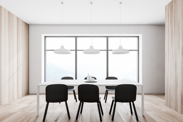 White and wooden dining room interior