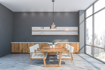 Gray kitchen with wooden counters and table