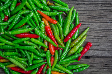 Organic red and green bird's eye chili, bird eye chili, bird's chili, chile de arbol, or Thai chili is a chili pepper, a cultivar from the species Capsicum annuum, commonly found in Southeast Asia.