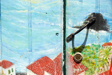 metal handle on a wooden door