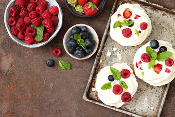 Mini Pavlova cakes with fresh berries