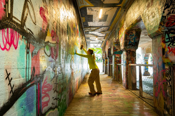 Spray Painting Graffiti in Krog Street Tunnel, Atlanta, Georgia
