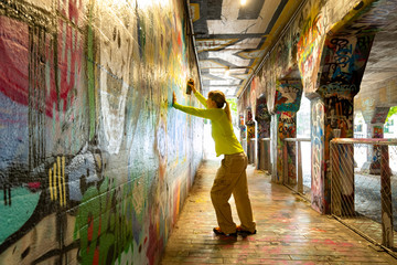 Spray Painting Graffiti in Krog Street Tunnel, Atlanta, Georgia
