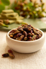 Sweet, delicate and fragrant nuts, Bronte pistachios with  brilliant green colour, ingredient for Italian cuisine, ice creams, cakes, pesto