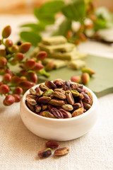 Sweet, delicate and fragrant nuts, Bronte pistachios with  brilliant green colour, ingredient for Italian cuisine, ice creams, cakes, pesto