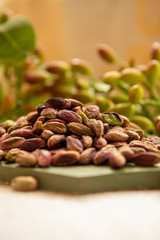 Fototapeta premium Sweet, delicate and fragrant nuts, Bronte pistachios with brilliant green colour, ingredient for Italian cuisine, ice creams, cakes, pesto
