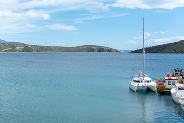 Fototapeta premium Seascape with big white catamaran yacht boat, vacation destination