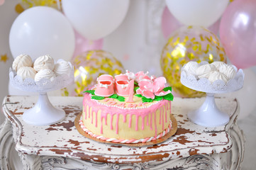 Cupcakes with pink frosting and sprinkles.