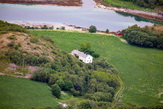 Old farmhouse seen from the mountain Torghatten