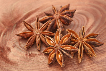 Anise star or anisetree spice on wood