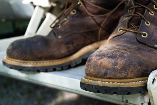 A Pair Of Well Used  Leather Work Boots.