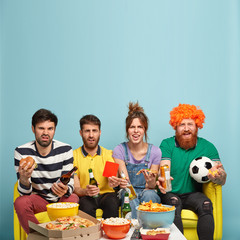 Displeased company of friends doesnt agree their favourite team received red card, watch game in...
