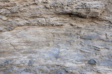 Obraz na płótnie Canvas Superfície texturizada de rocha natural, onde se podem ver as linhas desenhadas na rocha longo do tempo. Pode ser usada como fundo.