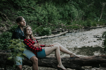 Beautiful couple walks in the woods