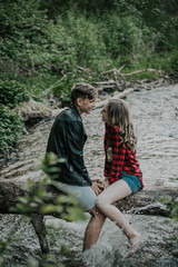 Beautiful couple walks in the woods