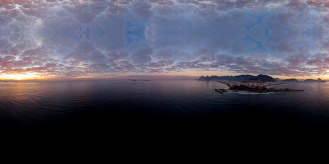 360 degree aerial panorama of Rio de Janeiro seen from just off the coast of the Arpoador rock with the wider cityscape in the background at sunrise ready for use in 3D environment mapping and 360VR.