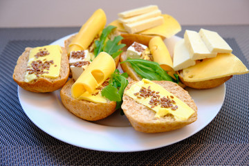 Fresh bread with cheese and basil for breakfast in a trip