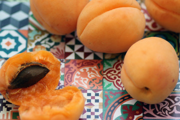fresh apricots on wooden table