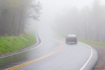 Car Disappears Into Dense Smoky Mountain Fog With Copy Space