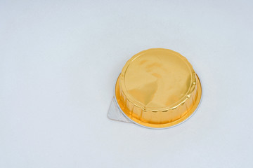 Canned pate on a white background. Canned food in gold packaging. Foil packaging for pate