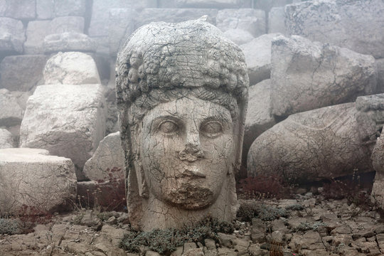 Ancient stone statue of goddess Tyche-Bakht on the top of Nemrut mount, Anatolia, Turkey
