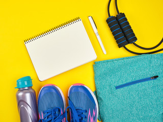 open empty notebook and sports women's clothing for sports and fitness