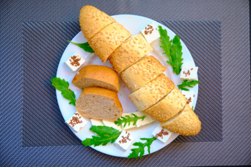 Fresh bread with cheese and basil for breakfast in a trip