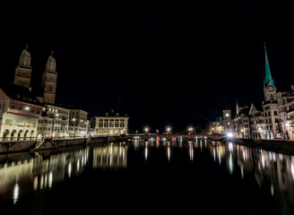 Fototapeta na wymiar Zurich Night Scene of the Limmat River with light reflections and flares