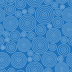 Seamless abstract pattern with white circles on blue background