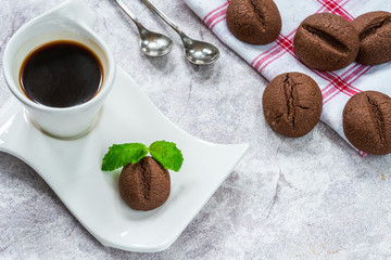 Coffee bean cookies with espresso coffee in a cup - high angle view