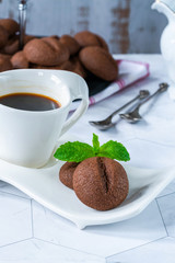 Coffee bean cookies with espresso coffee in a cup