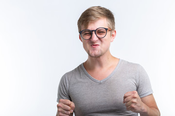 People and emotions concept - Unhappy funny man isolated over white background