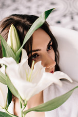 girl in the bathroom with white lily