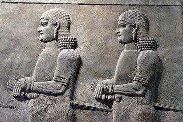 Ancient Sumerian stone carving on wall, bas relief on wall. 