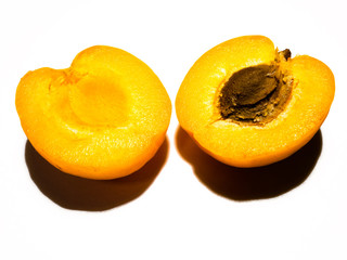 Apricot cut in half.