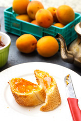 Fototapeta na wymiar breakfast with apricot jam and slice of bread, arabic tea 