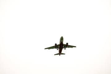 Aircraft on a background of cloudy sky. Landing a liner close-up. Spring. Day.
