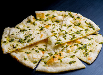 vegan pizza on a dark background