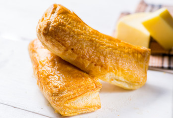 Fresh pastries on a white background close-up. Several rolls with filling on a white background