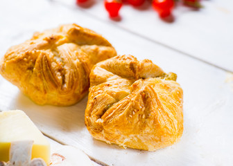 Fresh pastries on a white background close-up. Ingredients for the filling on the background.